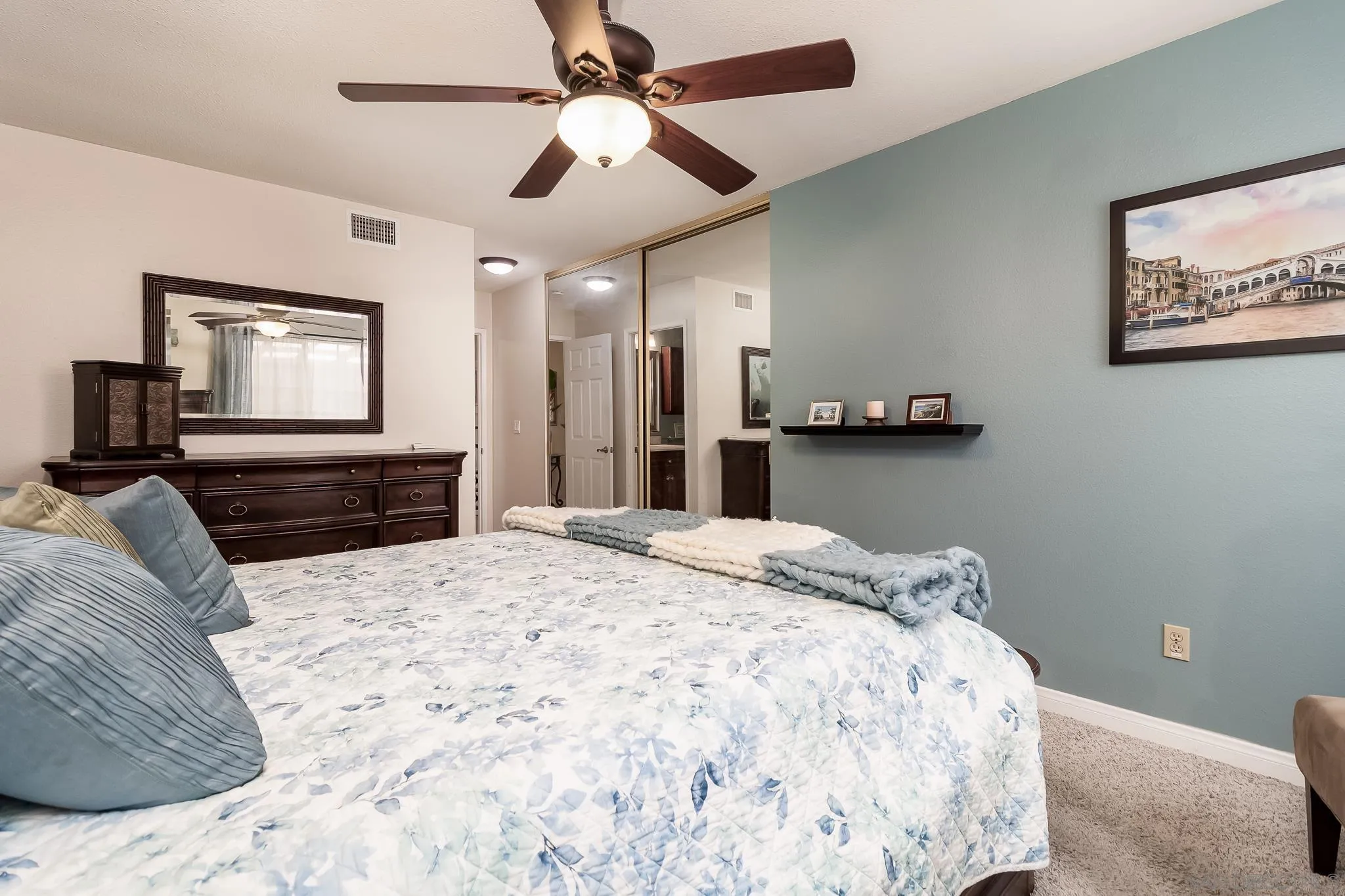 8537 Cordial Road El Cajon, CA 92021 - Photo 13 of 37 a bedroom with a bed and a chandelier