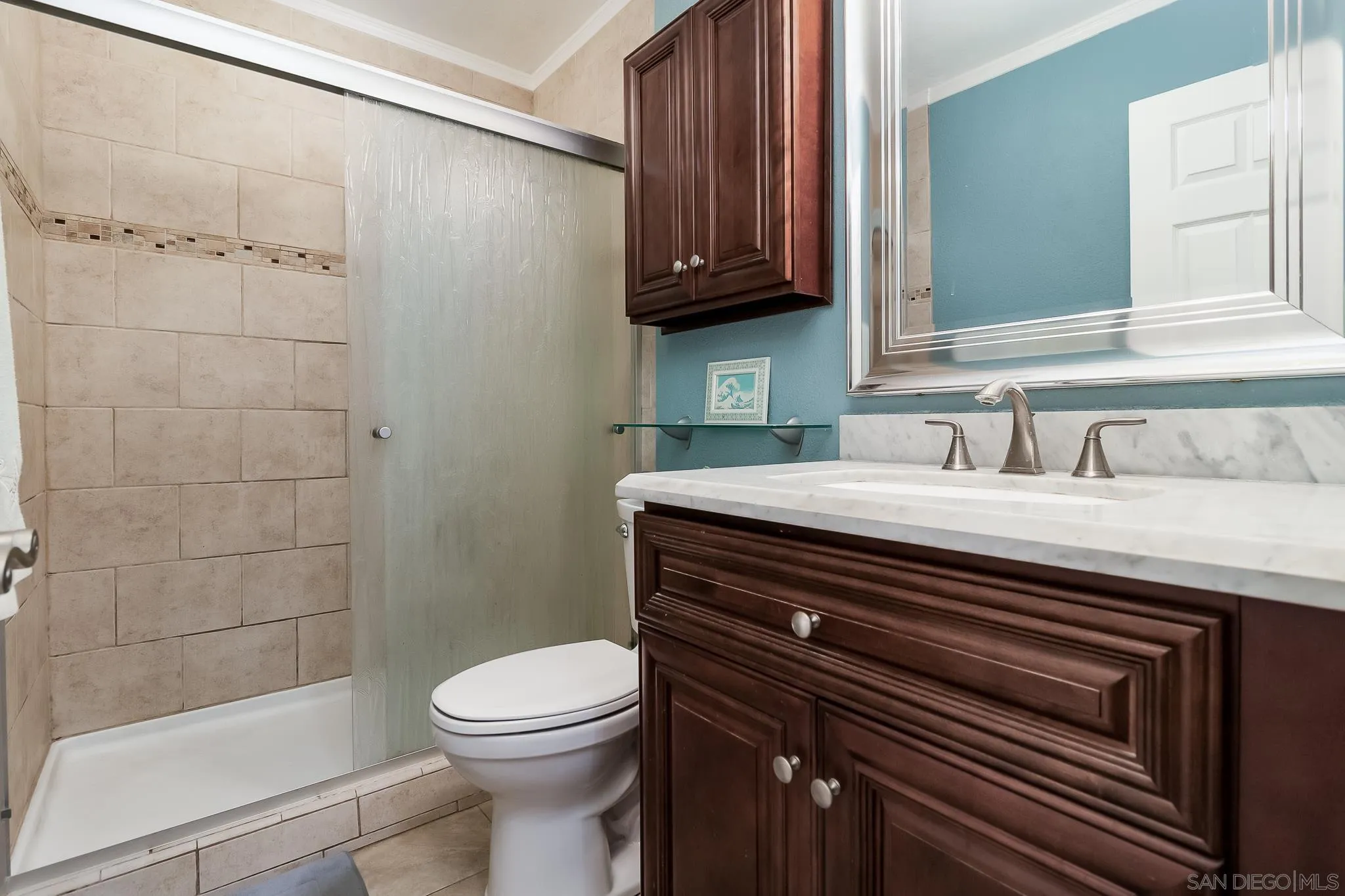8537 Cordial Road El Cajon, CA 92021 - Photo 14 of 37 a bathroom with a sink a toilet and shower