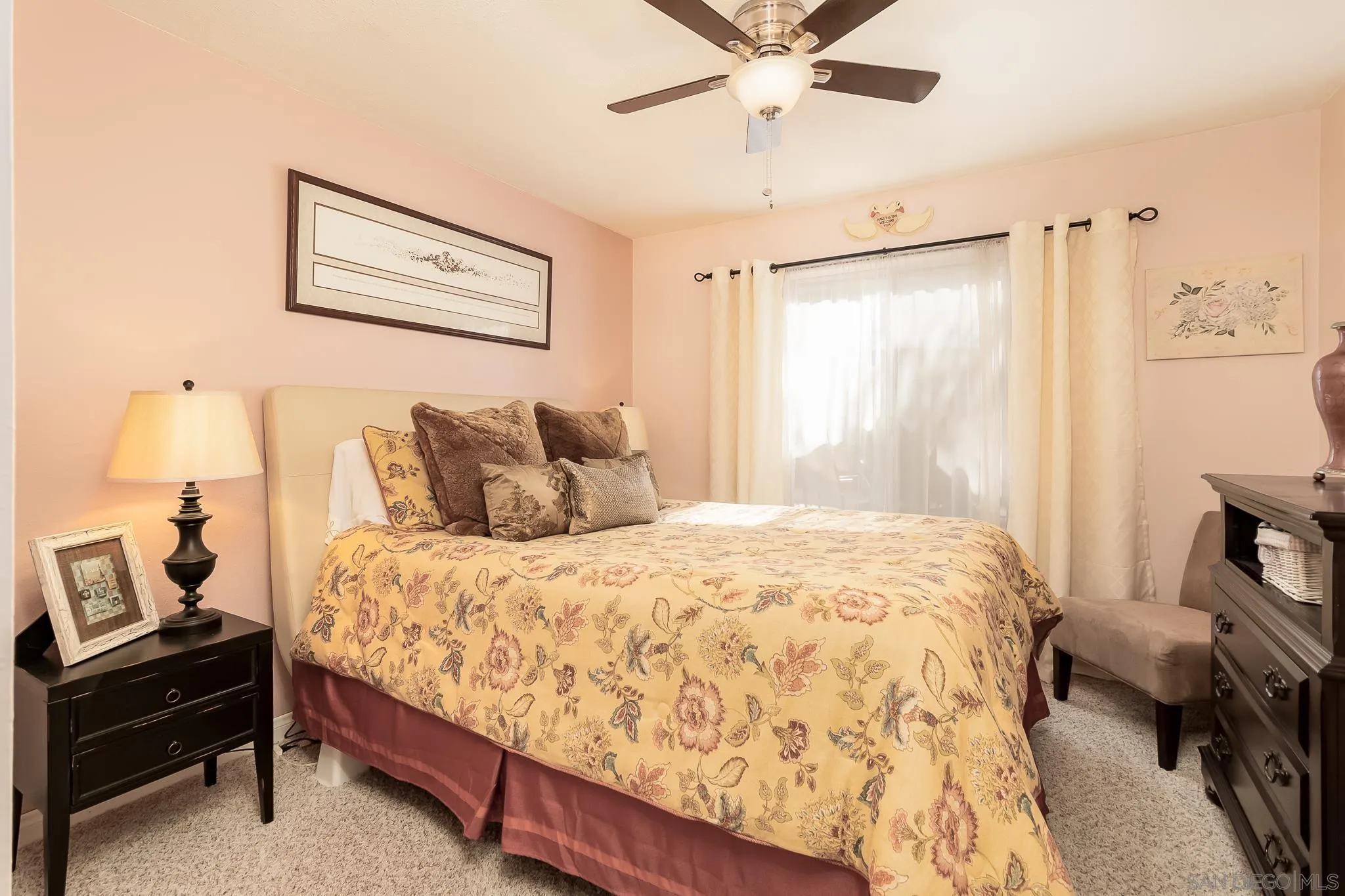 8537 Cordial Road El Cajon, CA 92021 - Photo 16 of 37 a bedroom with a bed and a chandelier