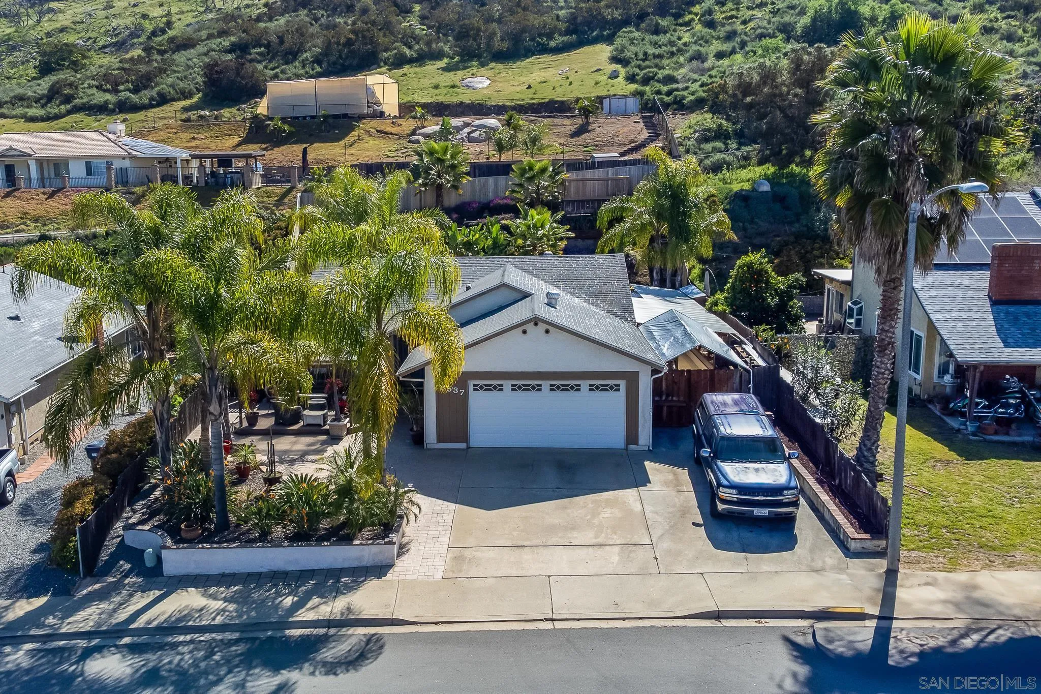 8537 Cordial Road El Cajon, CA 92021 - Photo 2 of 37 an aerial view of a house with a yard and fountain