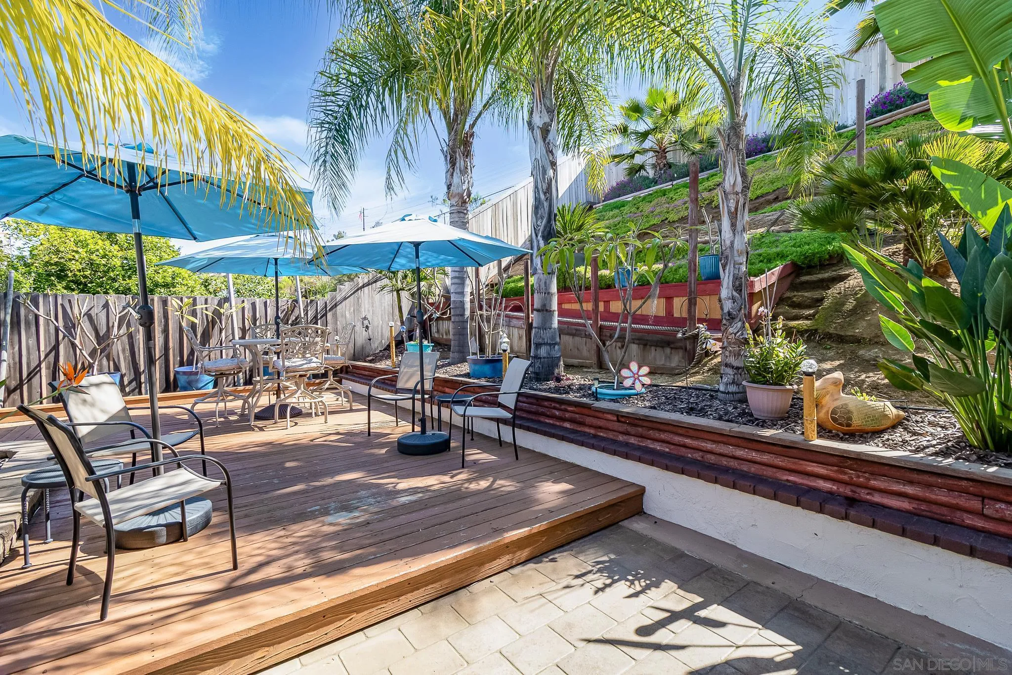 8537 Cordial Road El Cajon, CA 92021 - Photo 30 of 37 a view of a chairs and table under an umbrella in patio