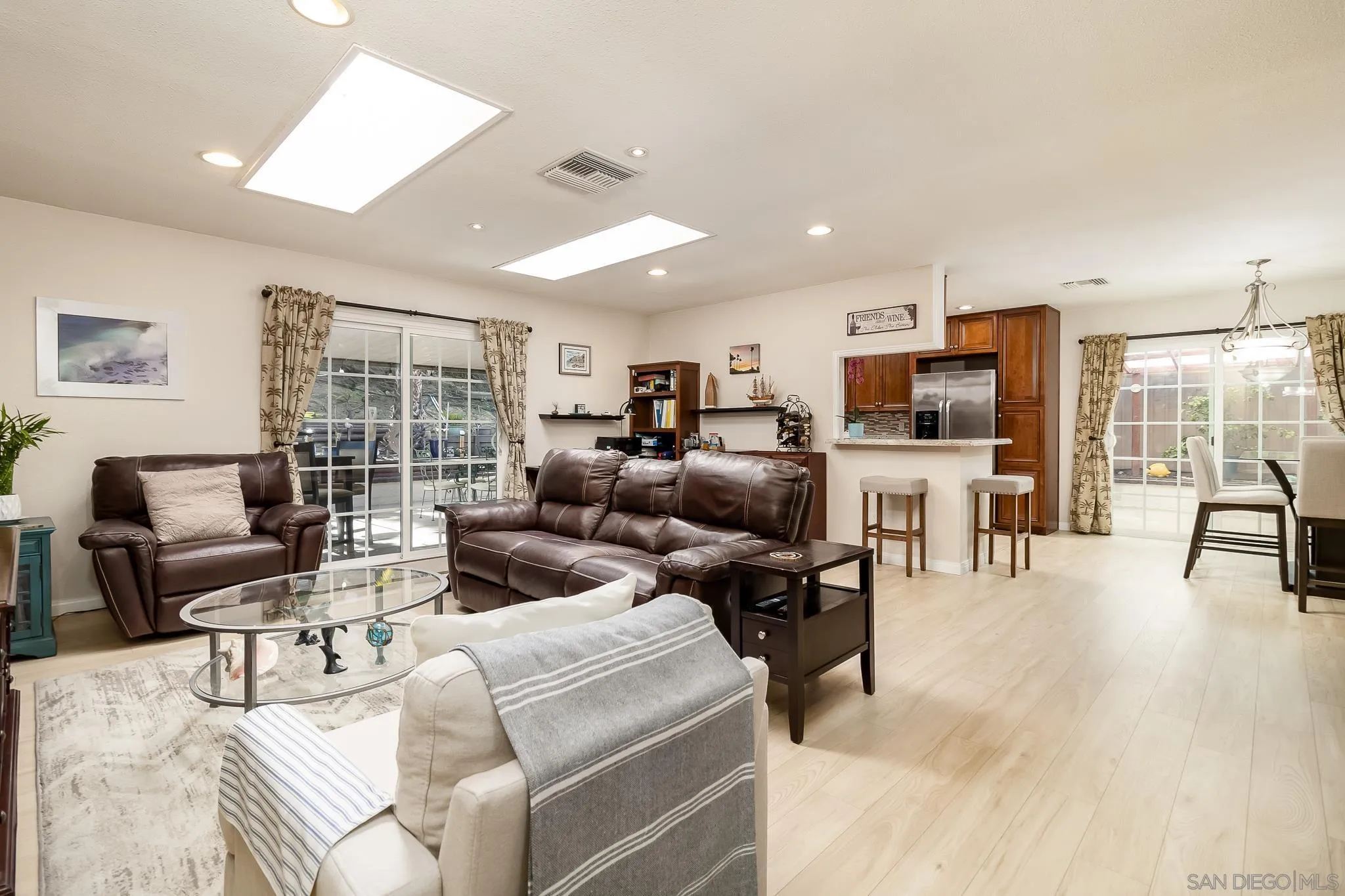 8537 Cordial Road El Cajon, CA 92021 - Photo 3 of 37 a living room with furniture and a flat screen tv