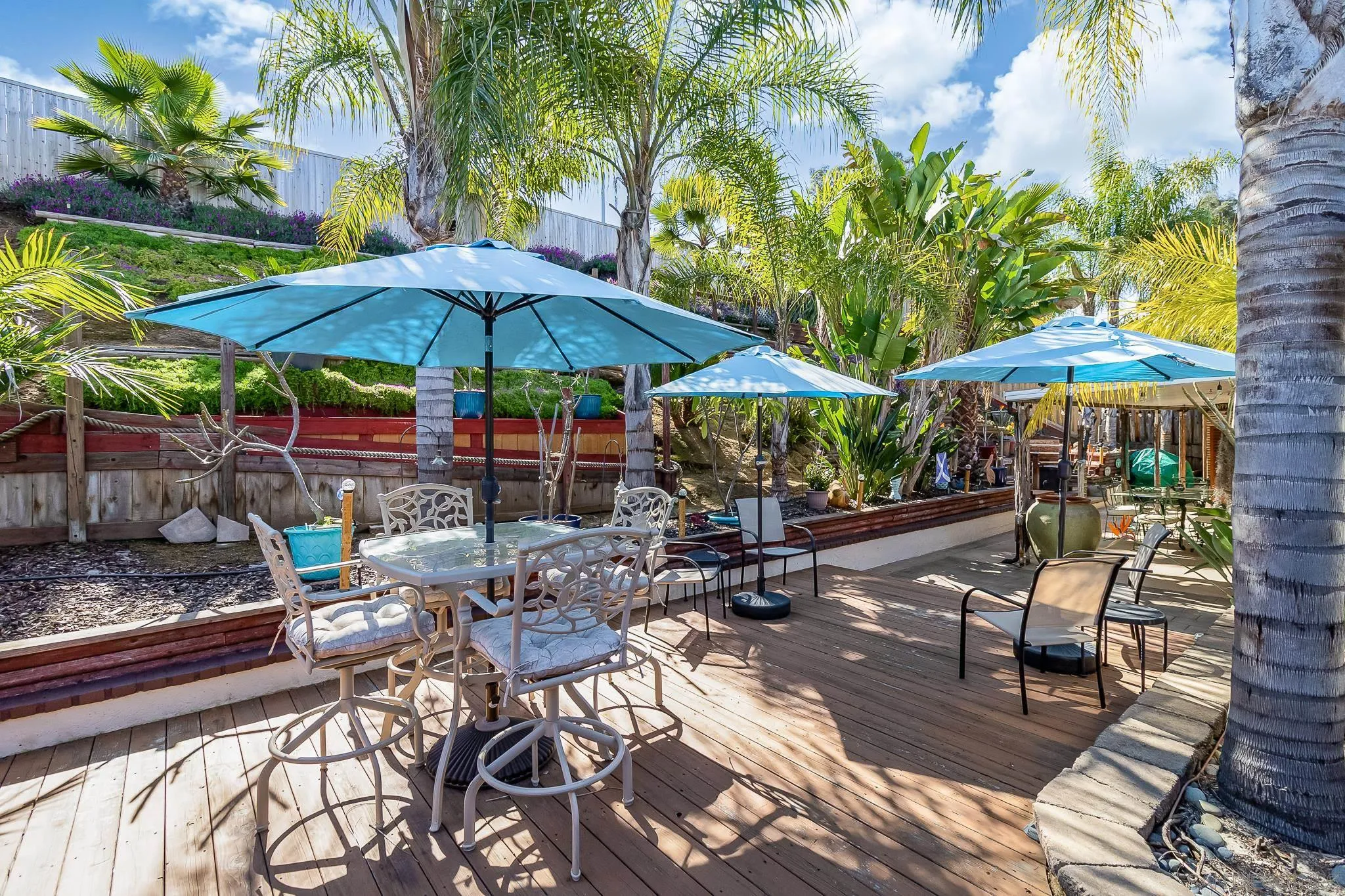 8537 Cordial Road El Cajon, CA 92021 - Photo 31 of 37 a view of patio with chairs and table under an umbrella with a barbeque