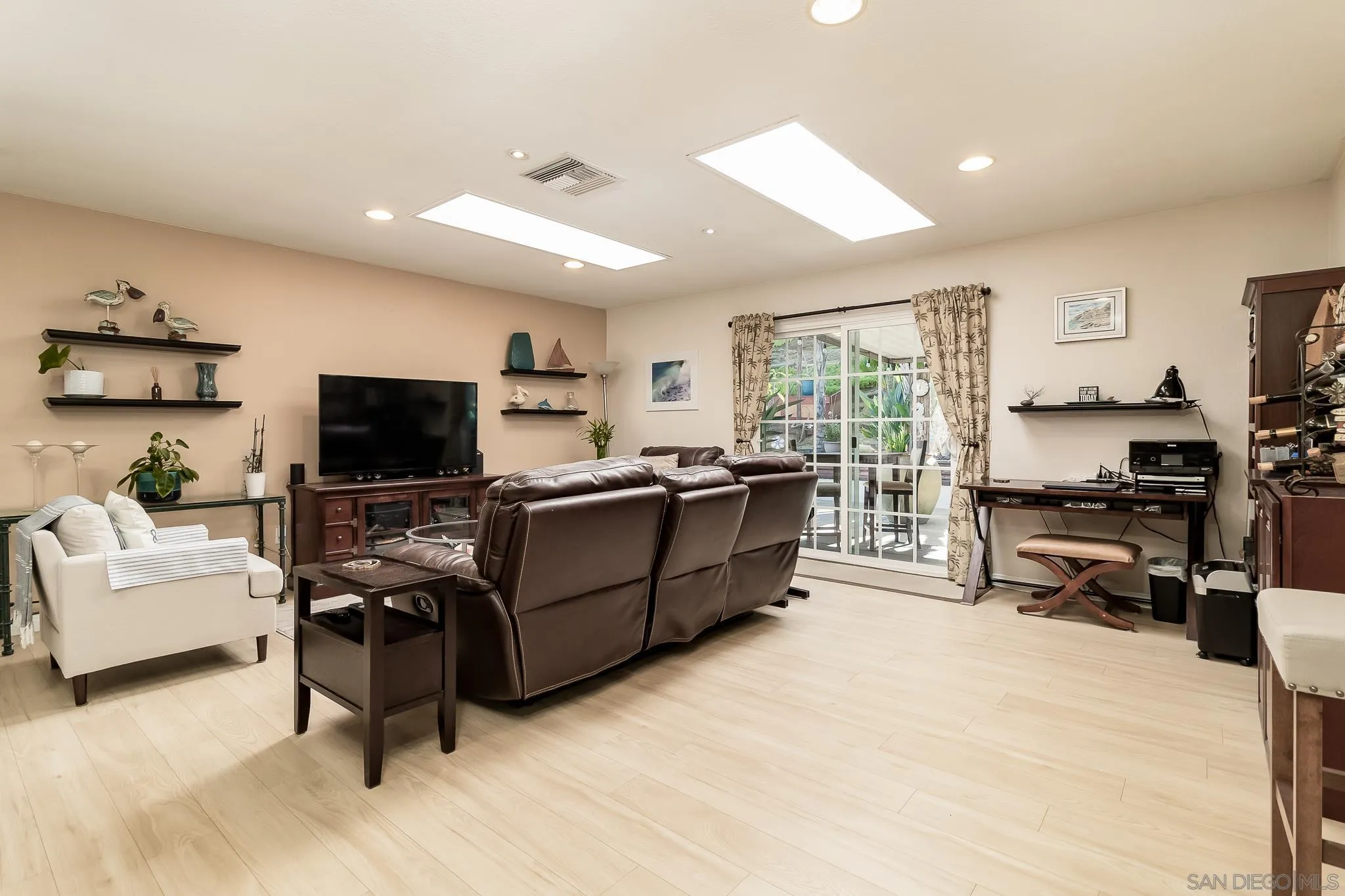 8537 Cordial Road El Cajon, CA 92021 - Photo 4 of 37 a living room with furniture and a flat screen tv