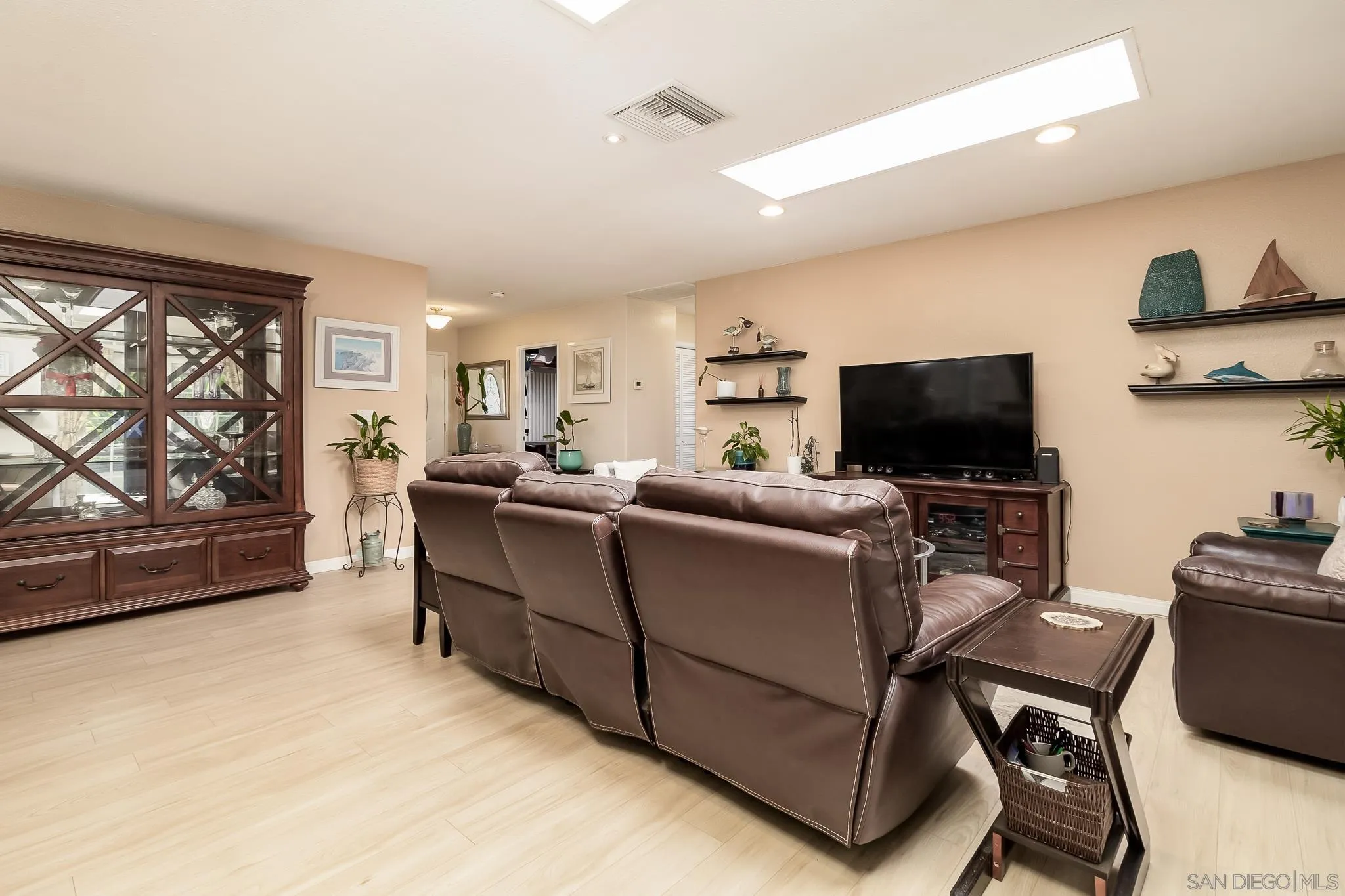 8537 Cordial Road El Cajon, CA 92021 - Photo 5 of 37 a living room with furniture and a flat screen tv