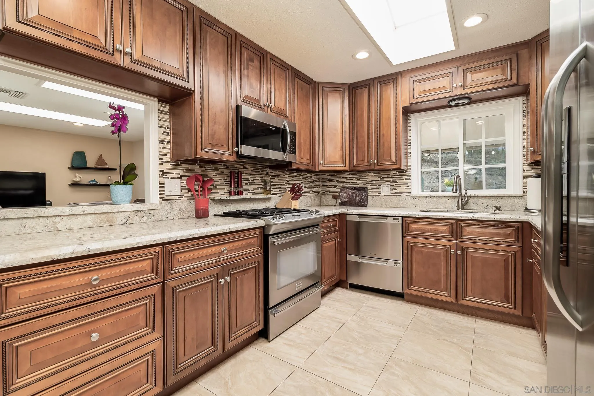 8537 Cordial Road El Cajon, CA 92021 - Photo 10 of 37 a kitchen with cabinets appliances a sink and a counter top space