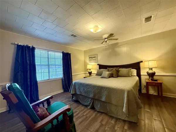 a bedroom with a bed and window