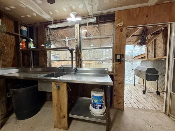a kitchen with a sink and a refrigerator