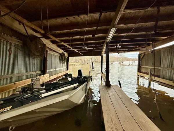 a roof deck with table and chairs