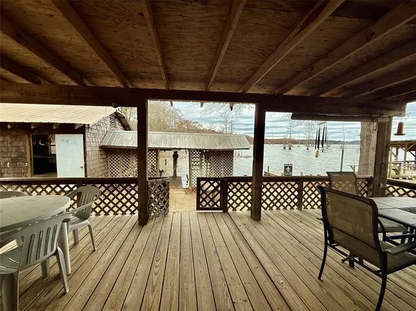 a view of a chairs and table in patio
