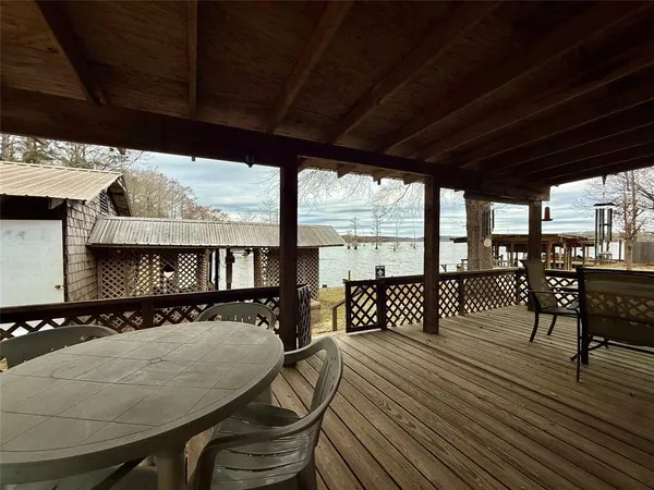 a view of a lake with houses in the back