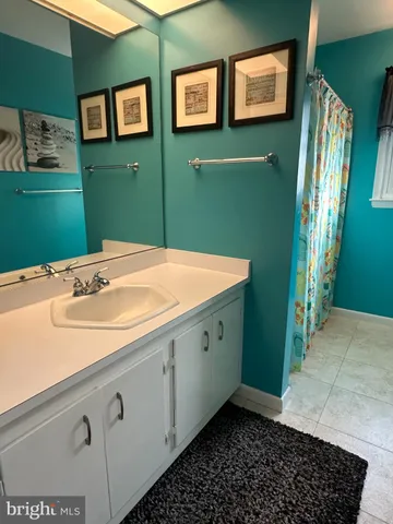 a kitchen with a refrigerator and a sink