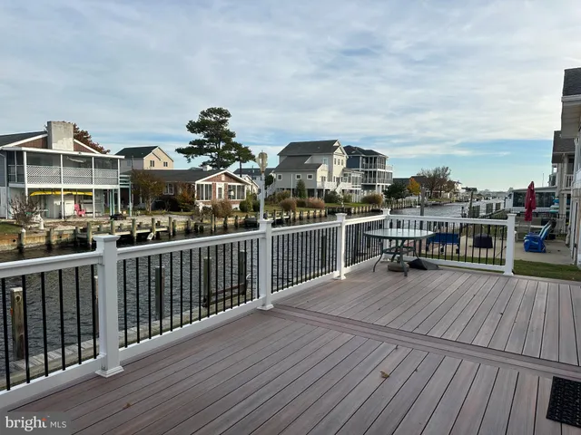a view of a balcony with wooden floor