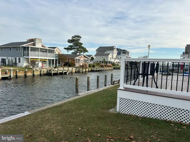 a view of a house with a wooden deck