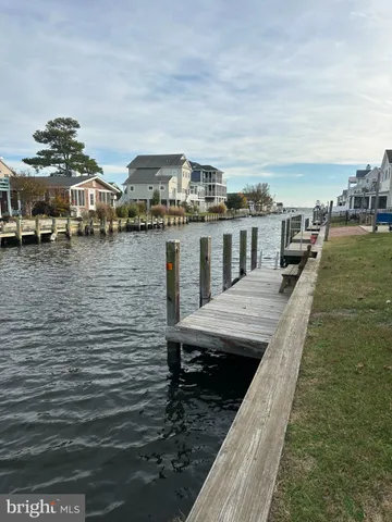 a front view of a house with outdoor seating