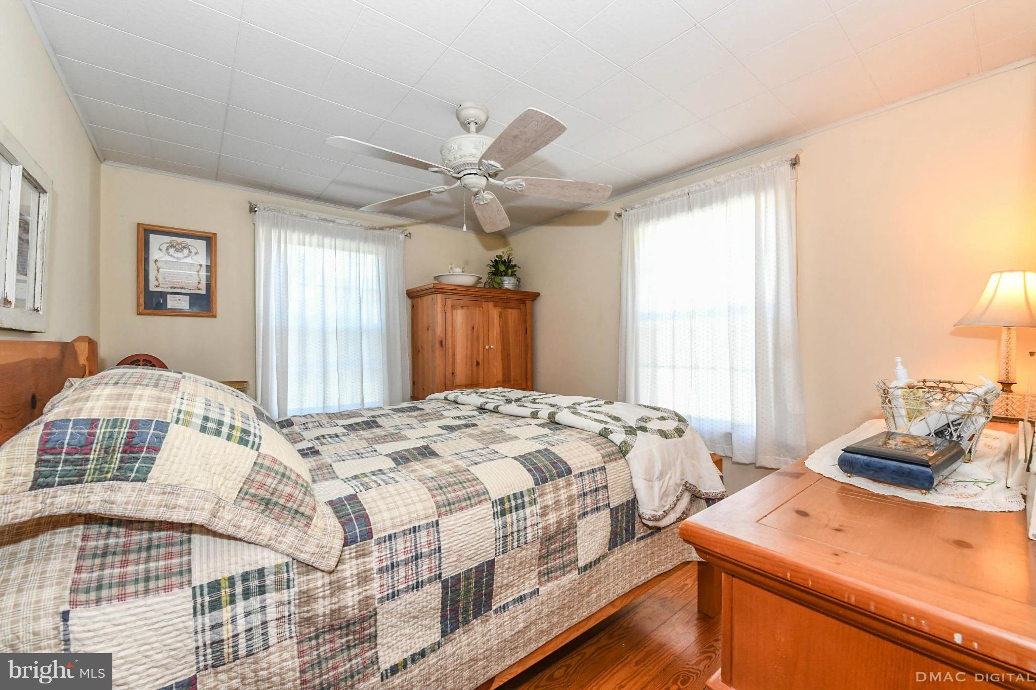 8701 Yellow Springs Road, Unit C Frederick, MD 21702 - Photo 14 of 30 a bedroom with a bed and a dresser