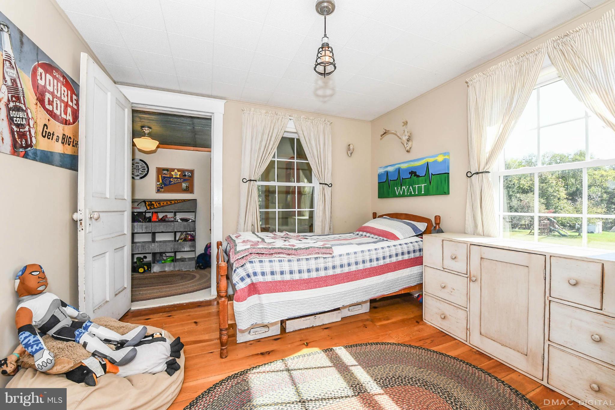 8701 Yellow Springs Road, Unit C Frederick, MD 21702 - Photo 16 of 30 a bed room with a bed and a window