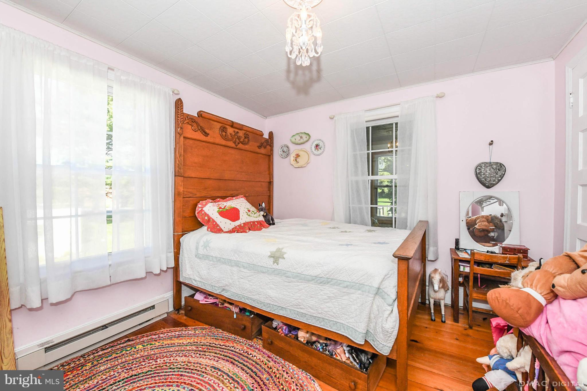 8701 Yellow Springs Road, Unit C Frederick, MD 21702 - Photo 18 of 30 a bedroom with a bed and a window