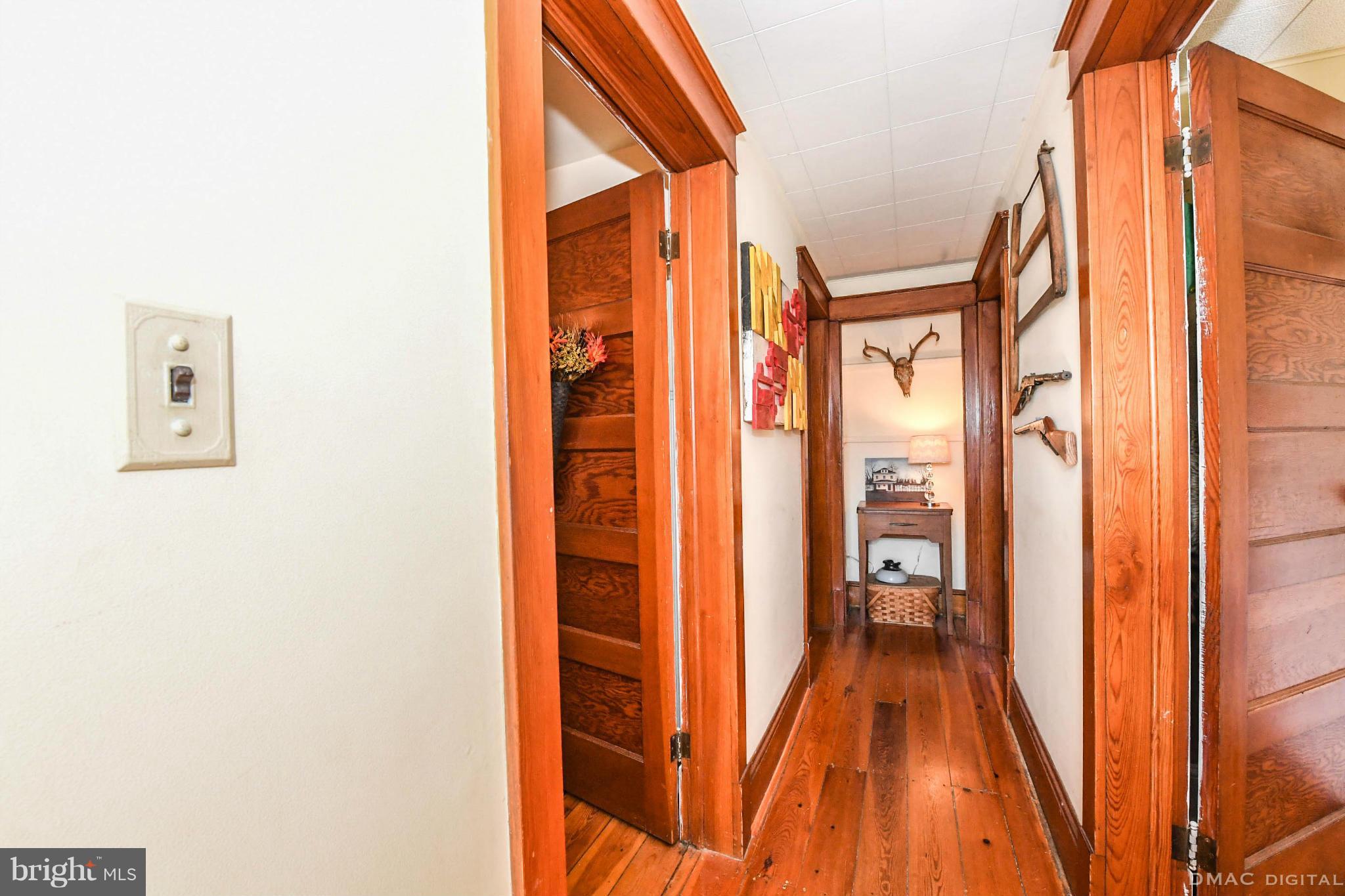 8701 Yellow Springs Road, Unit C Frederick, MD 21702 - Photo 20 of 30 a view of a hallway with wooden floor and staircase