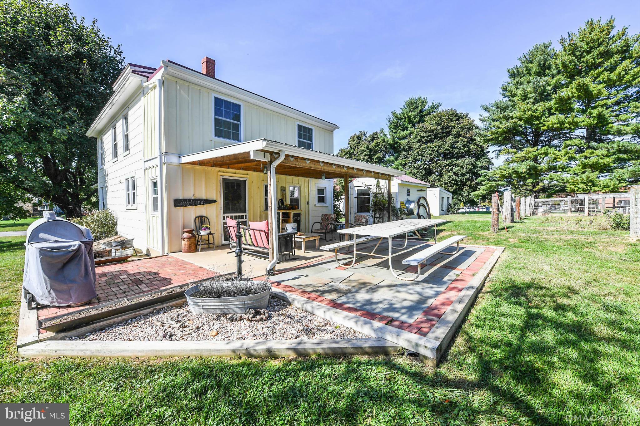 8701 Yellow Springs Road, Unit C Frederick, MD 21702 - Photo 23 of 30 a view of a house with backyard porch and sitting area