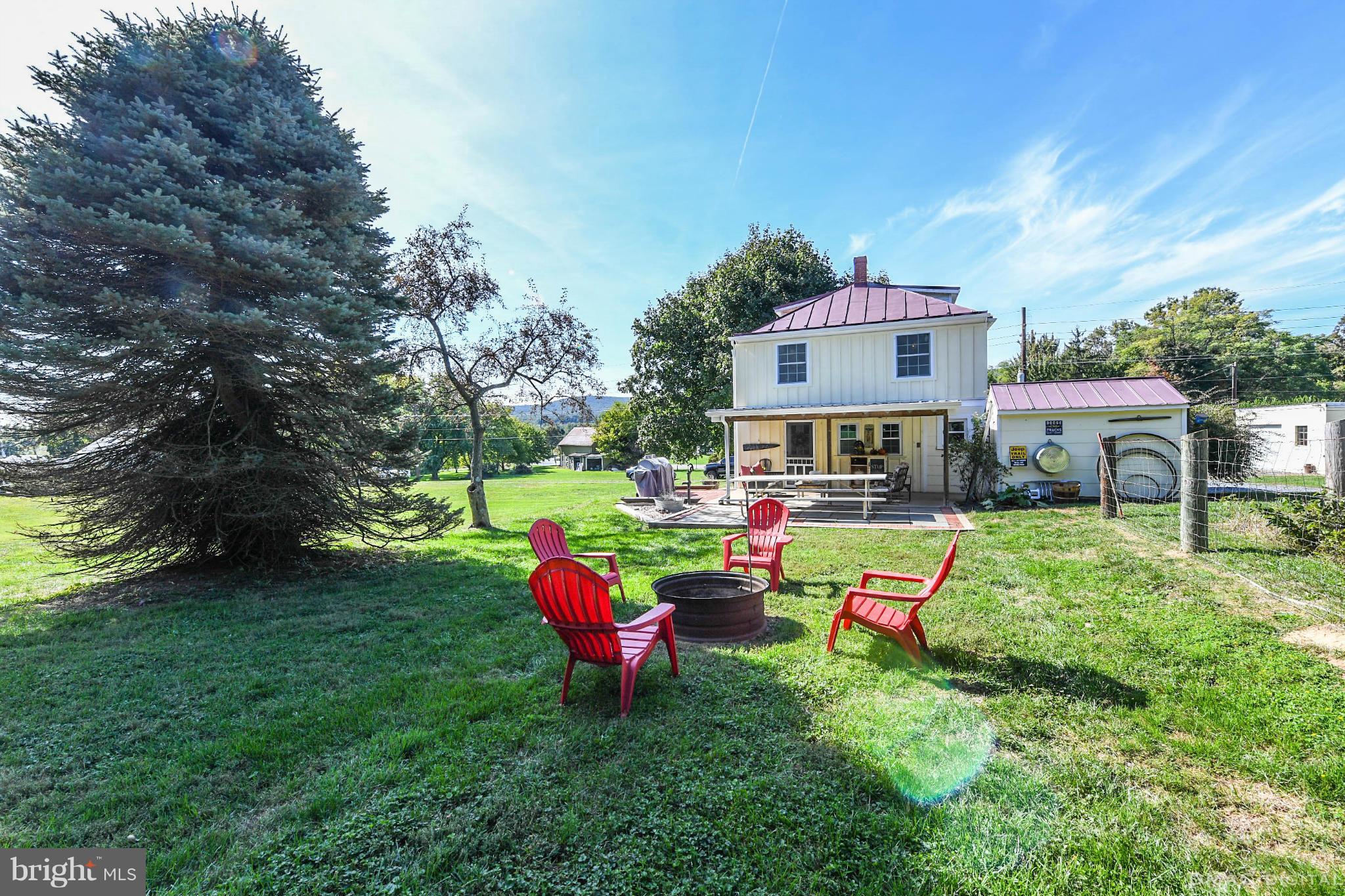 8701 Yellow Springs Road, Unit C Frederick, MD 21702 - Photo 26 of 30 a backyard of a house with table and chairs