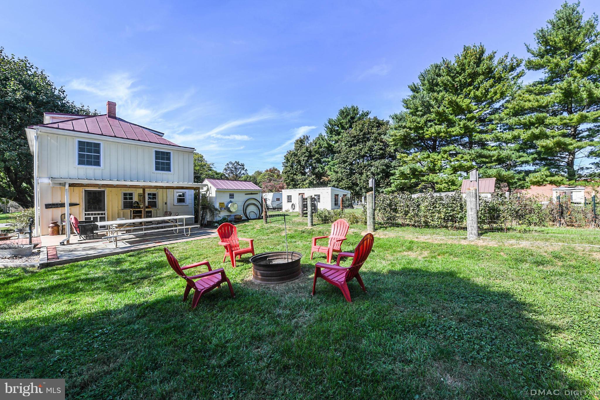 8701 Yellow Springs Road, Unit C Frederick, MD 21702 - Photo 27 of 30 a backyard of a house with table and chairs
