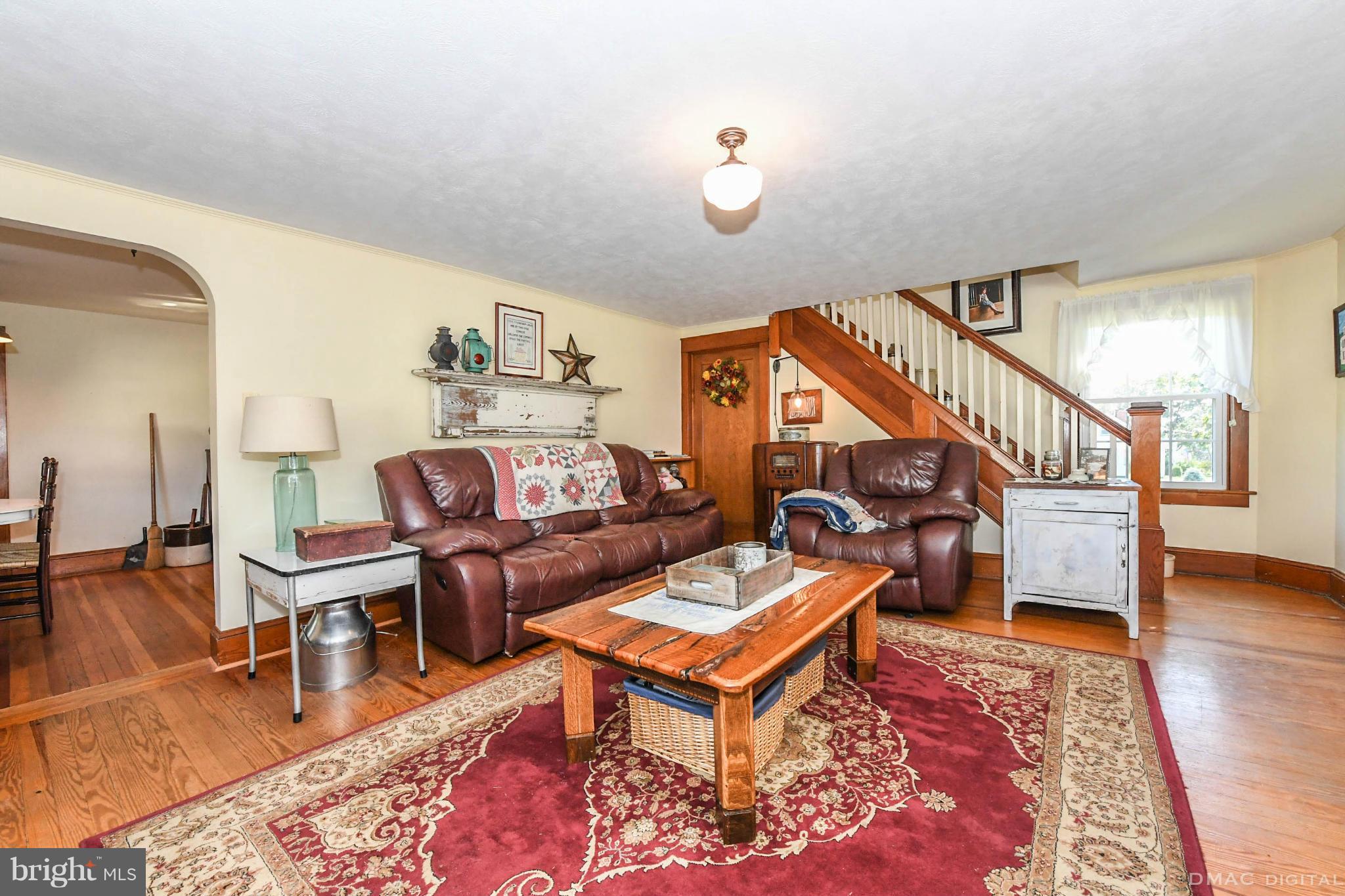 8701 Yellow Springs Road, Unit C Frederick, MD 21702 - Photo 7 of 30 a living room with furniture and a wooden floor