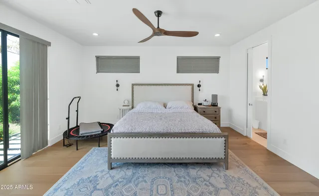 a bed room with a bed and a night stand