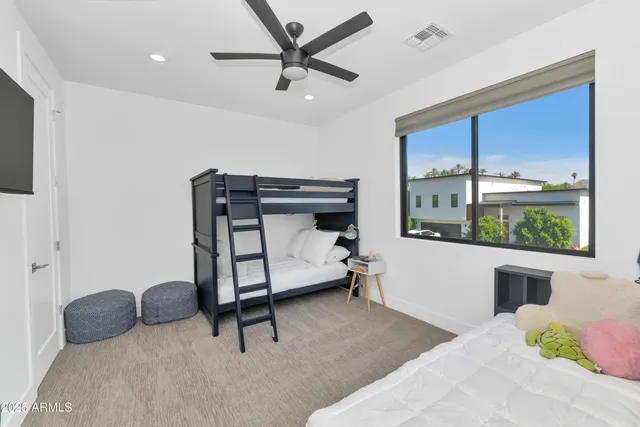 a bedroom with furniture and a window