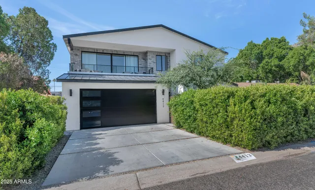 a front view of a house with yard