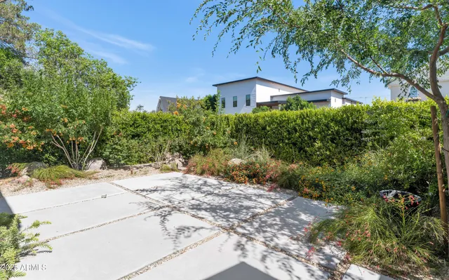 a backyard of a house with lots of green space
