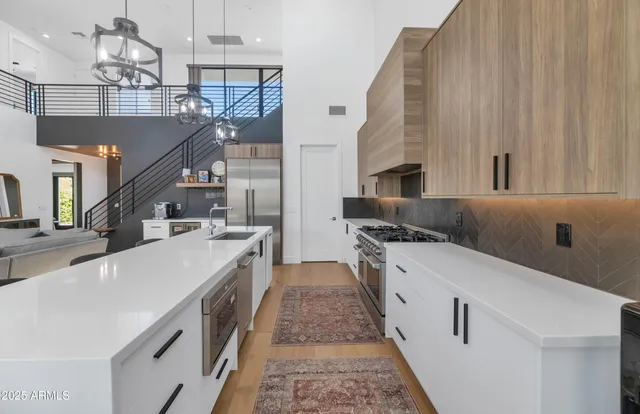 a kitchen with stainless steel appliances granite countertop a sink and dishwasher