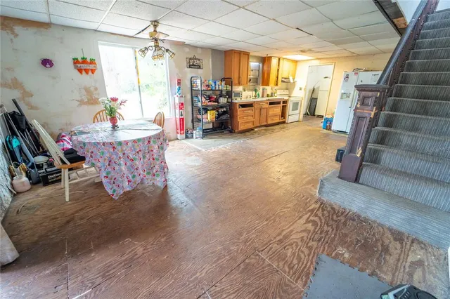 a kitchen with stainless steel appliances granite countertop a stove a sink dishwasher and a refrigerator