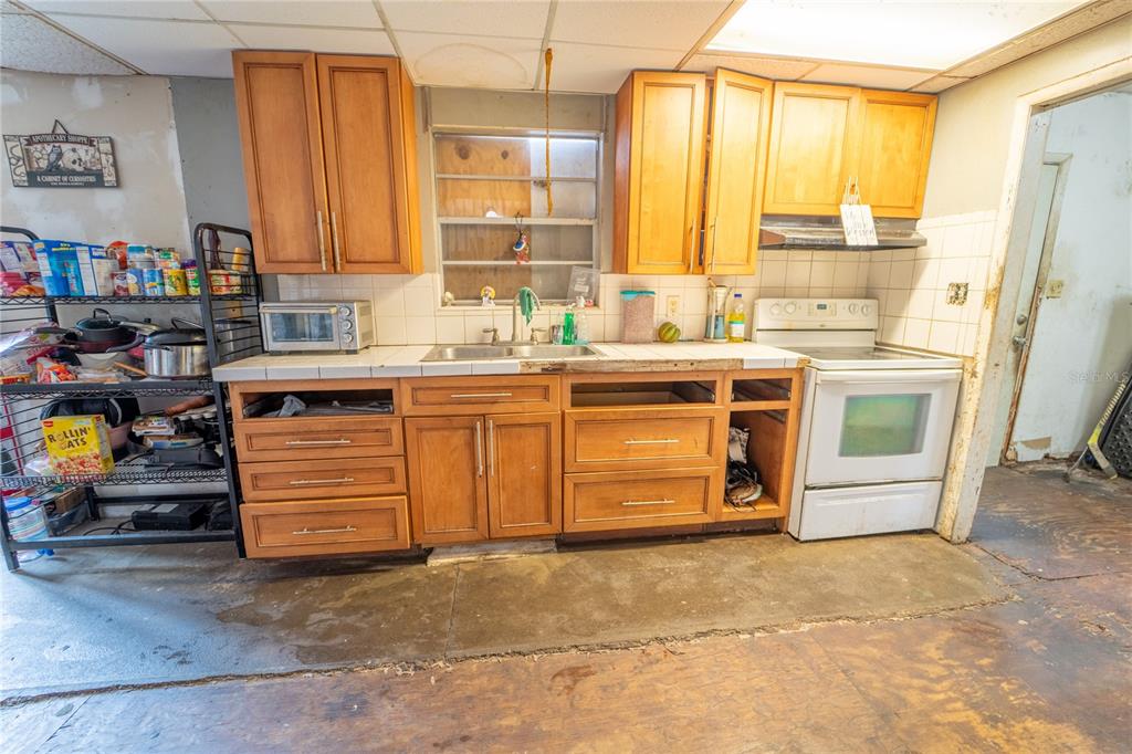7813 Valrie Lane Riverview, FL 33569 - Photo 14 of 48 a kitchen with stainless steel appliances granite countertop a stove a sink dishwasher and a refrigerator