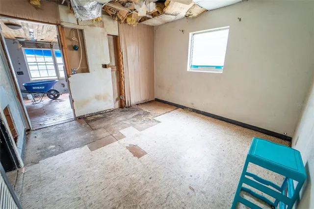 a living room with a furniture and a rug