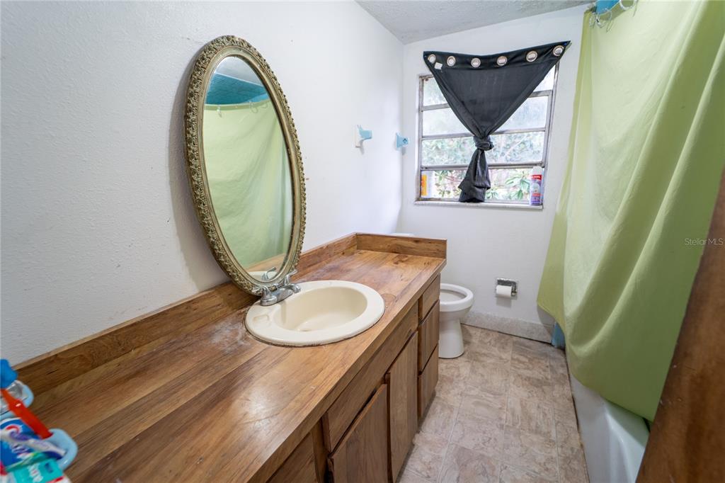 7813 Valrie Lane Riverview, FL 33569 - Photo 23 of 48 a bathroom with a sink a toilet and a mirror