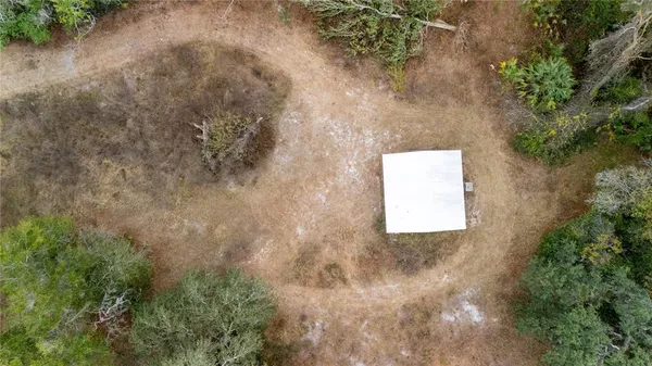 an outdoor view of house and backyard