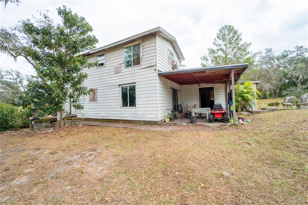 7813 Valrie Lane Riverview, FL 33569 - Photo 6 of 48 a view of a house with backyard and trees