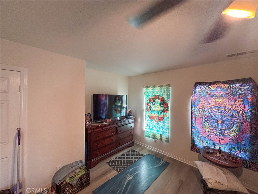 29120 Turtle Rock Court Menifee, CA 92587 - Photo 21 of 40 a living room with furniture and a flat screen tv