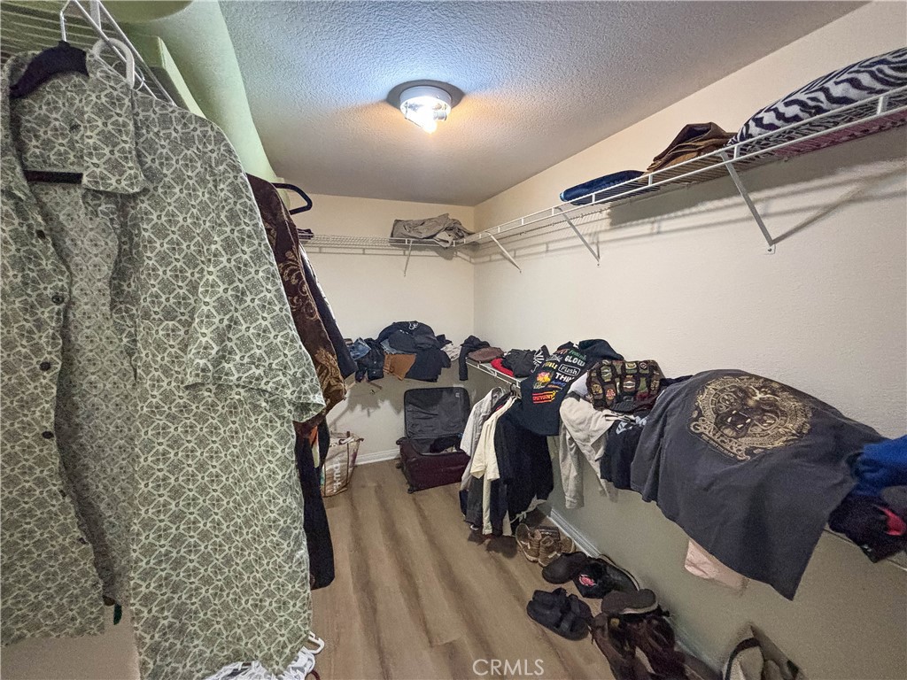 29120 Turtle Rock Court Menifee, CA 92587 - Photo 25 of 40 a view of walk in closet with clothes and shoes