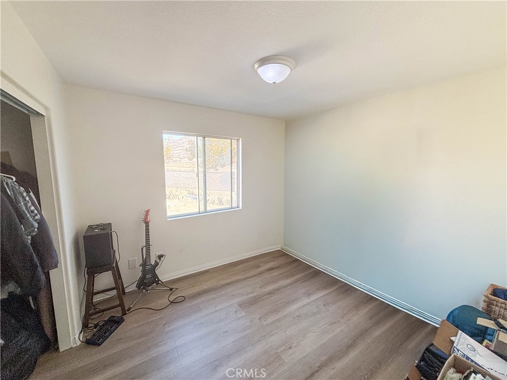 29120 Turtle Rock Court Menifee, CA 92587 - Photo 33 of 40 a view of a room with wooden floor and furniture