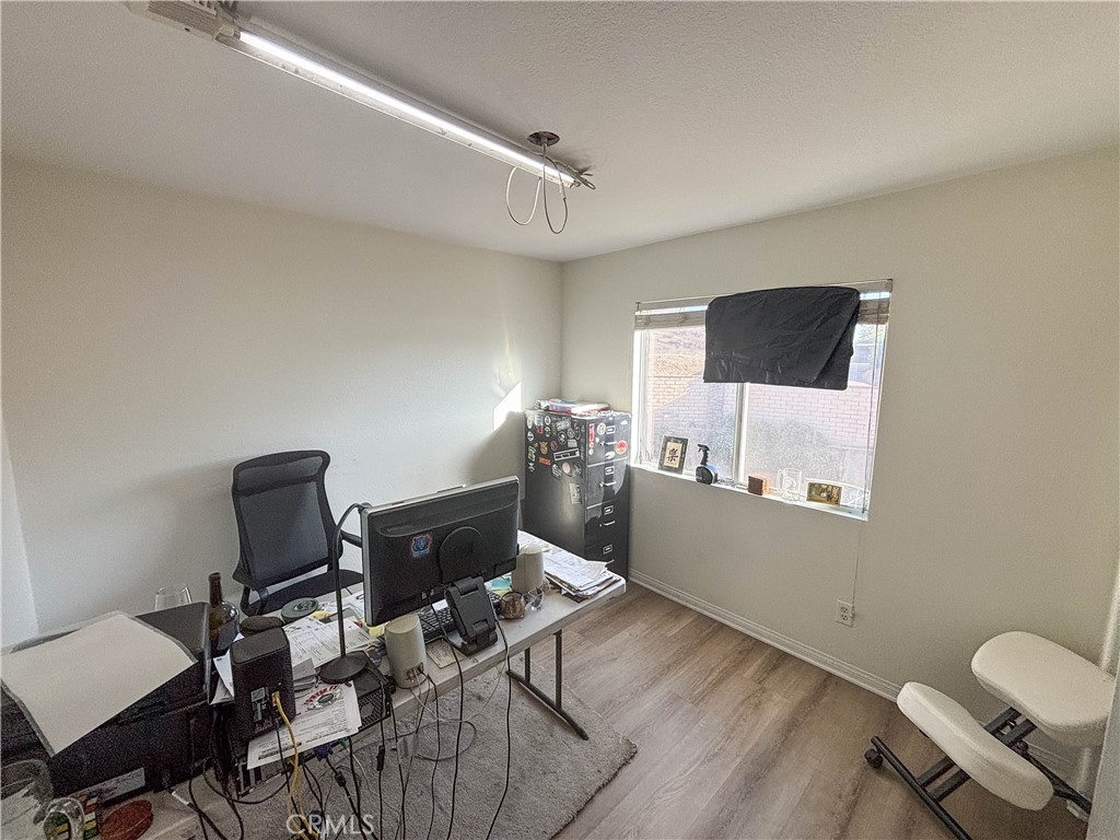29120 Turtle Rock Court Menifee, CA 92587 - Photo 34 of 40 a workspace with furniture and wooden floor
