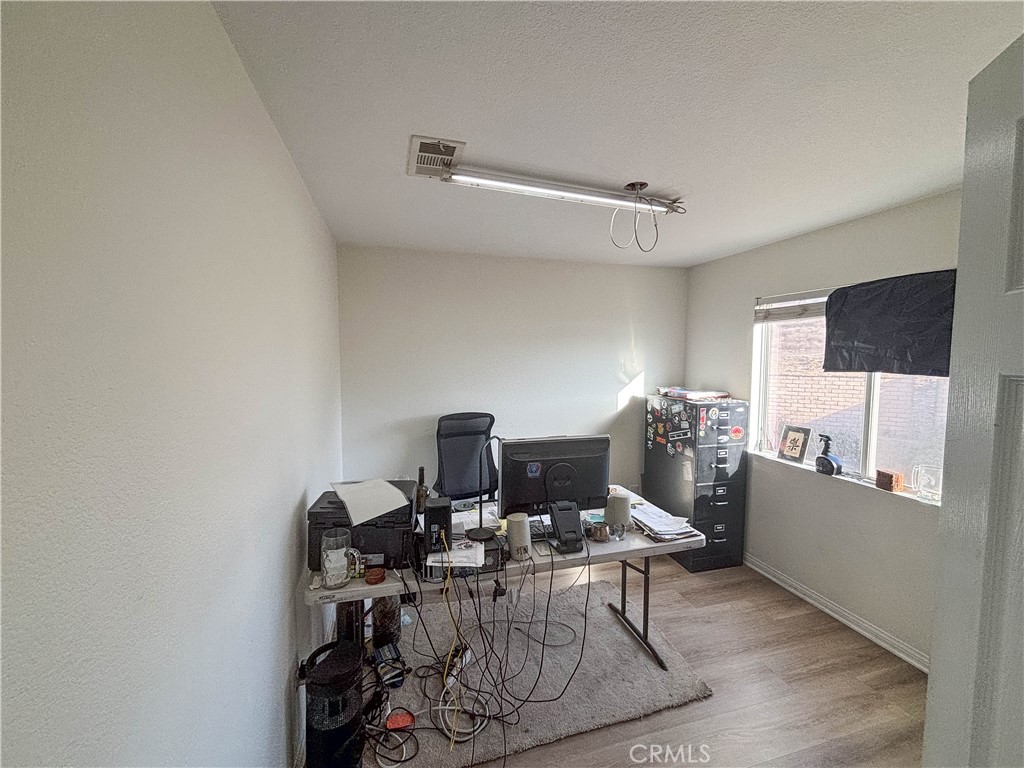 29120 Turtle Rock Court Menifee, CA 92587 - Photo 35 of 40 a workspace with furniture and a flat screen tv