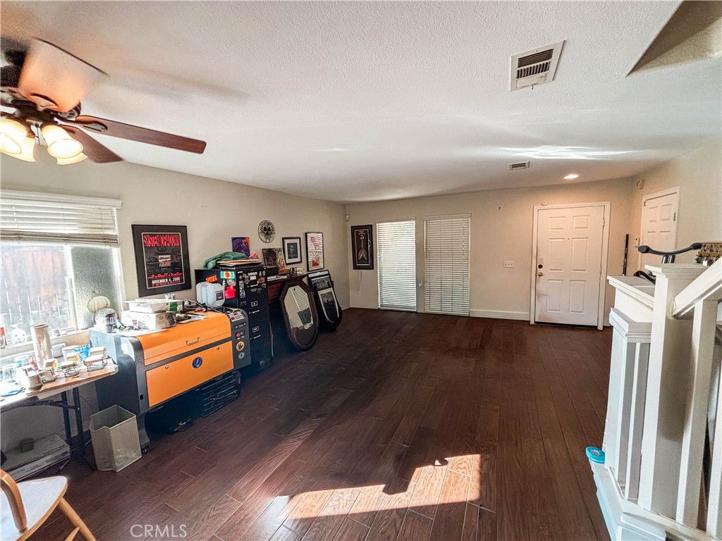 29120 Turtle Rock Court Menifee, CA 92587 - Photo 7 of 40 a living room with furniture and a flat screen tv