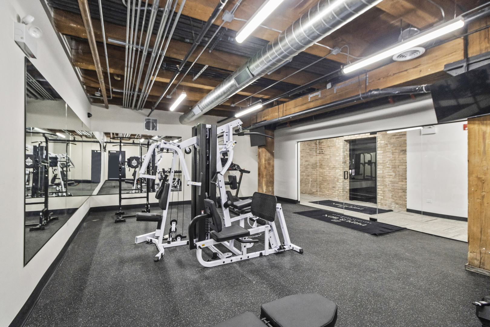 153 West Ohio Street, Unit 403 Chicago, IL 60654 - Photo 13 of 15 a view of a room with gym equipment