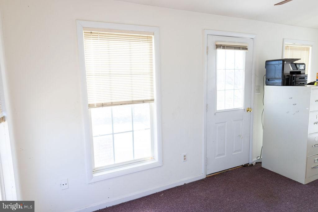 10510 Fountain School Road Union Bridge, MD 21791 - Photo 16 of 47 Bright sunroom on front of house; watch the sunset