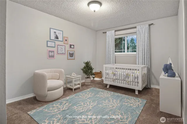 a bedroom with furniture and a window