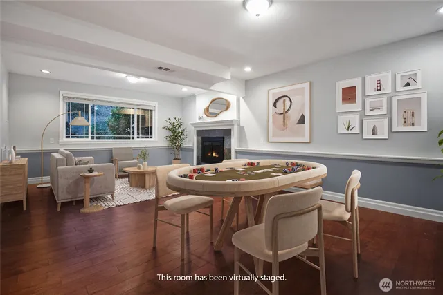 a view of a livingroom with furniture window and wooden floor