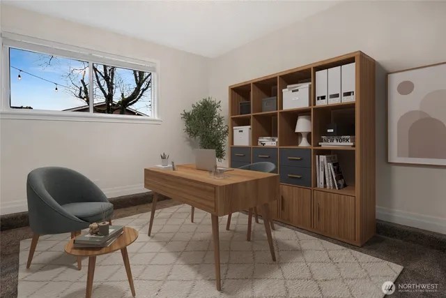 a work room with furniture and a book shelf