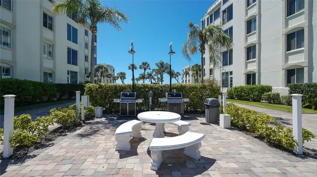 a view of a swimming pool with an outdoor seating